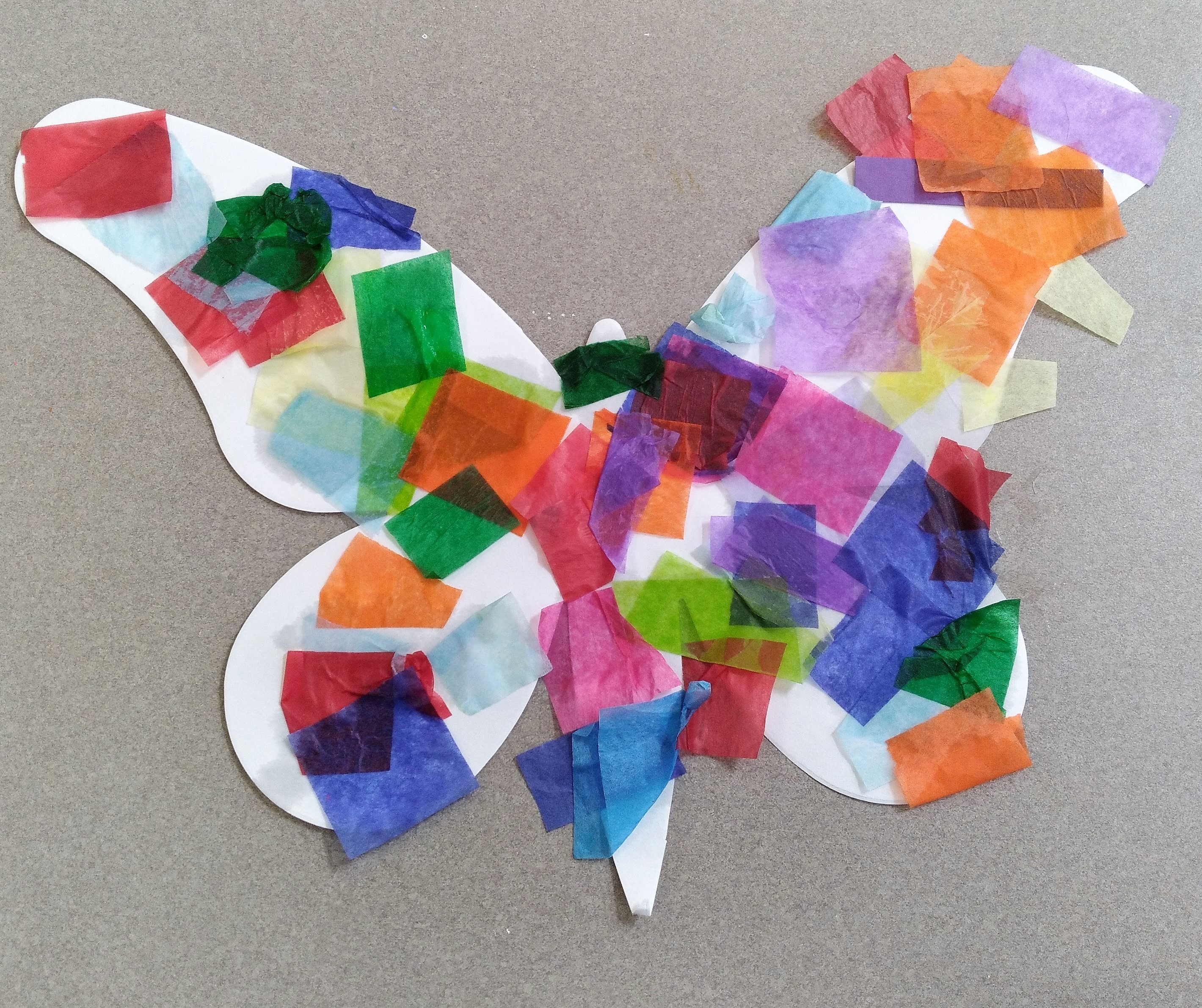 butterfly shaped white paper with colorful paper squares