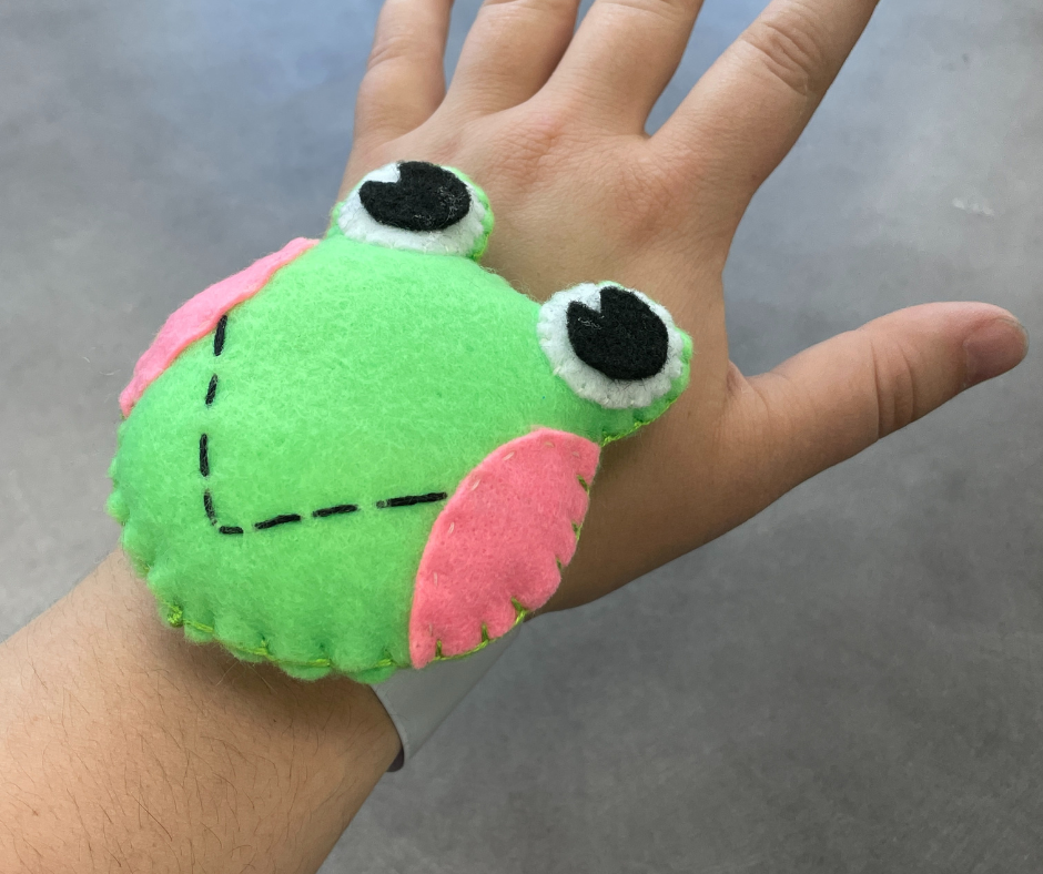 Sew Fun - Froggy Pincushion; stuffed froggy face, glued onto a slap bracelet