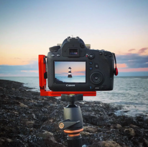 dslr camera looking at lighthouse