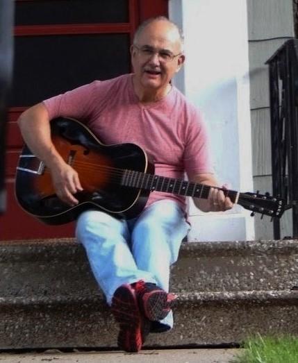 Paul Cioe with Guitar